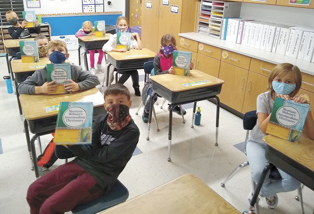 Lions bring dictionaries to Scandia Elementary